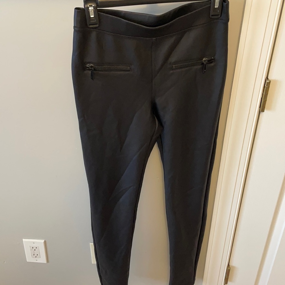 Black “leather” skinny pants with zipper detail